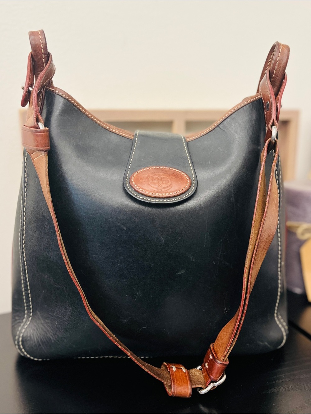 Dooney & Bourke Black Leather Shoulder Bag with Brown Trim